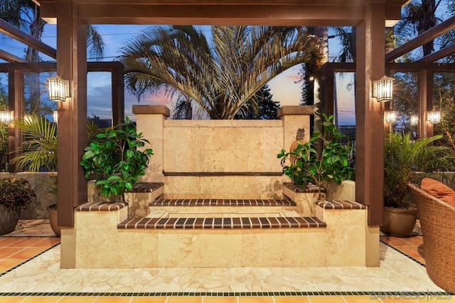 view of patio terrace at dusk