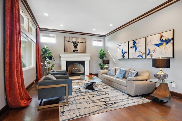 living room with dark wood-type flooring, a wealth of natural light, and crown molding