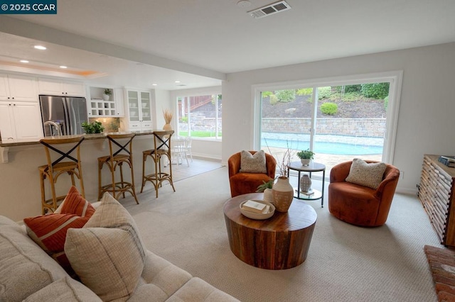 living room featuring light carpet