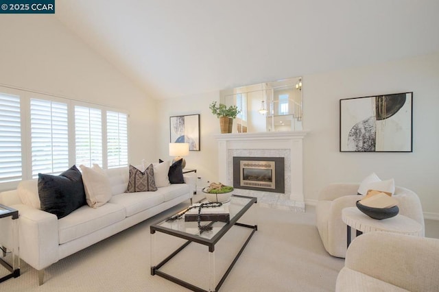 carpeted living room with lofted ceiling