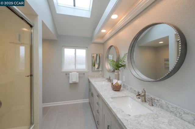 bathroom featuring vanity, lofted ceiling with skylight, and walk in shower