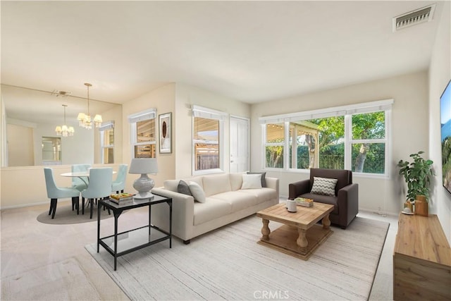 living room with a notable chandelier