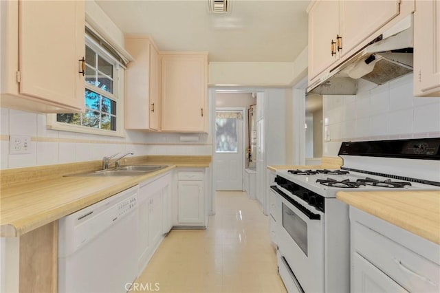 kitchen featuring sink and white appliances