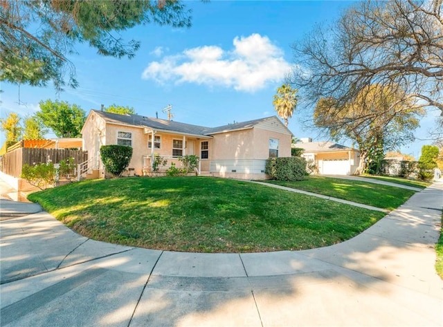 ranch-style house featuring a garage and a front yard