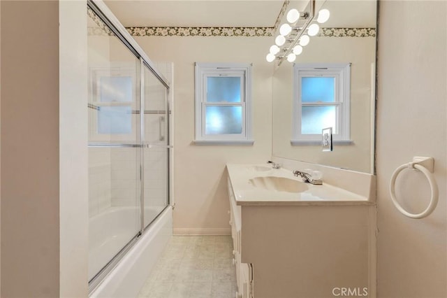 bathroom with combined bath / shower with glass door and vanity