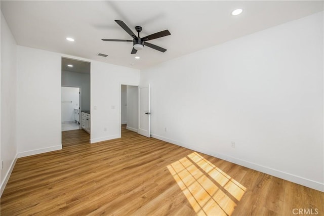 unfurnished bedroom featuring ceiling fan and light wood-type flooring