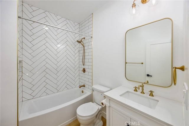 full bathroom featuring vanity, toilet, and tiled shower / bath combo