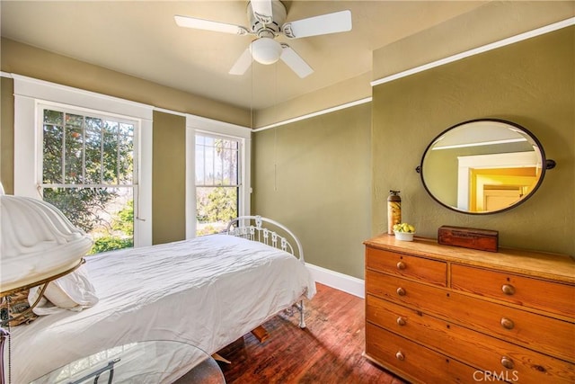 bedroom featuring hardwood / wood-style floors and ceiling fan