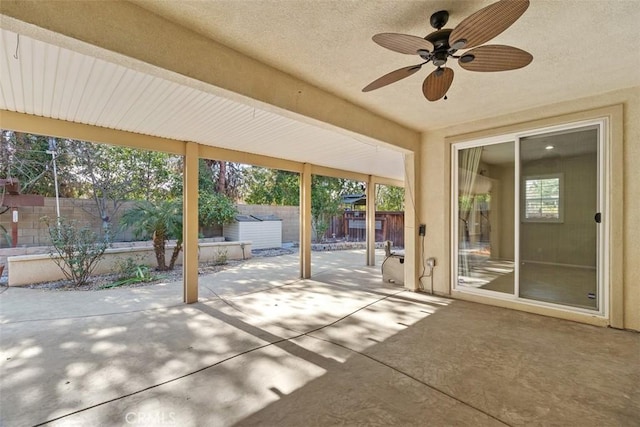 view of patio with ceiling fan and a fenced backyard