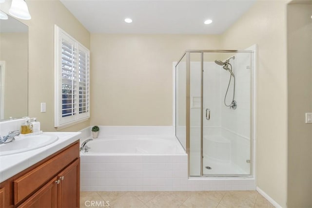 bathroom with a stall shower, tile patterned floors, a garden tub, vanity, and recessed lighting