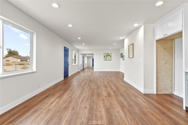 unfurnished living room featuring light hardwood / wood-style flooring