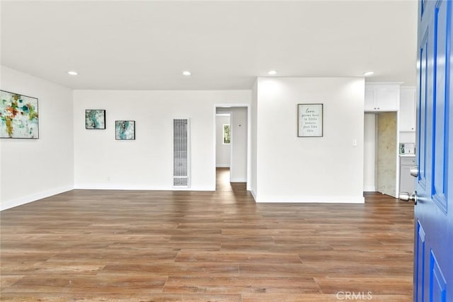 empty room featuring wood-type flooring