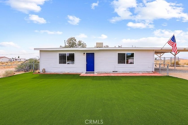 rear view of house with a lawn