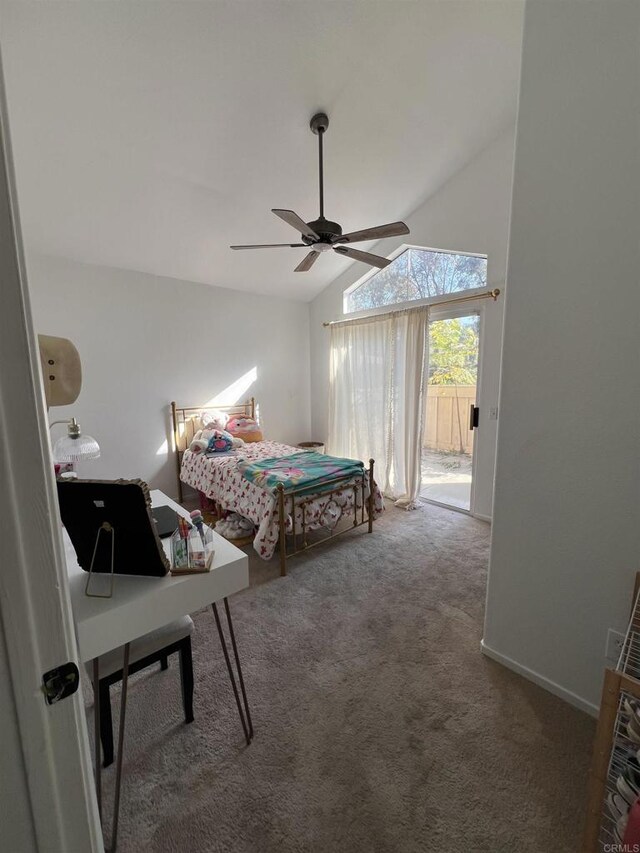 carpeted bedroom featuring access to exterior, vaulted ceiling, and ceiling fan