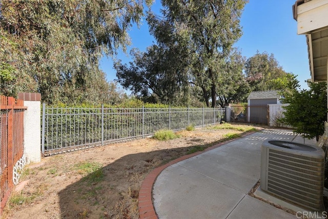 view of yard featuring central AC and a patio area