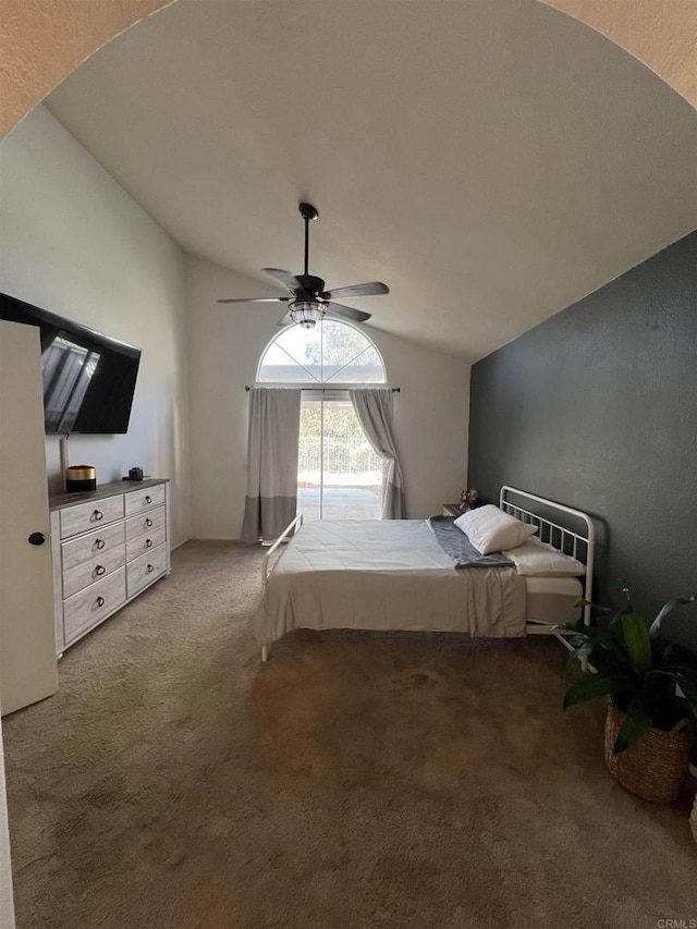 unfurnished bedroom with lofted ceiling, ceiling fan, and carpet