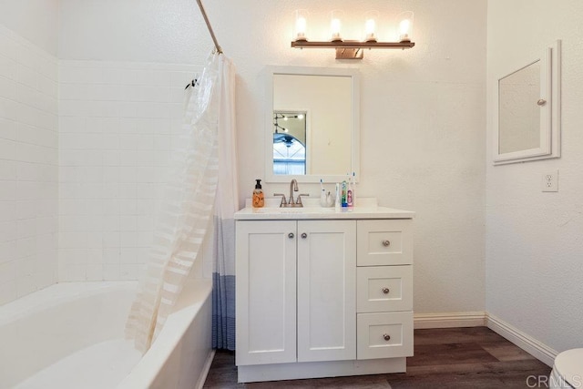 full bathroom featuring shower / tub combo with curtain, vanity, toilet, and hardwood / wood-style floors