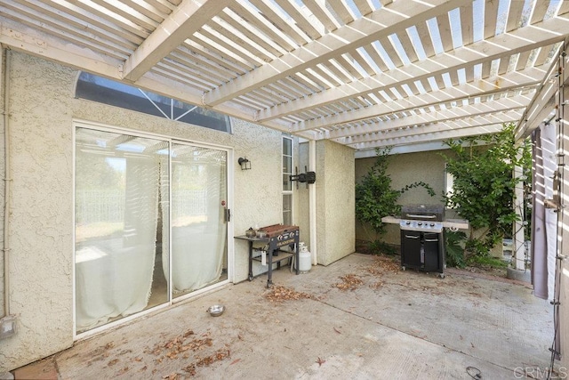 view of patio featuring area for grilling and a pergola