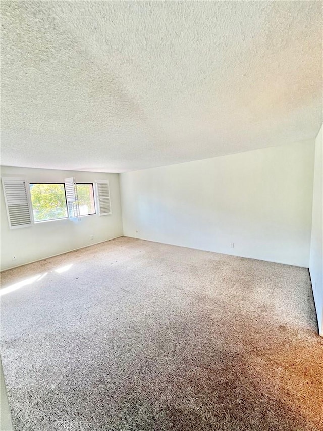 1 Cabrillo Dr, Avalon, CA 90704 - empty room featuring carpet and a textured ceiling