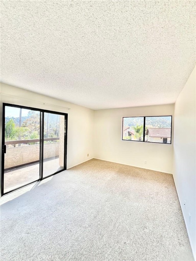 1 Cabrillo Dr, Avalon, CA 90704 - spare room with carpet flooring and a textured ceiling