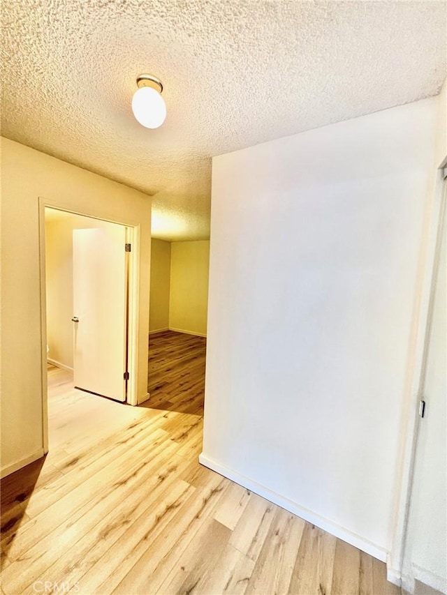 1 Cabrillo Dr, Avalon, CA 90704 - spare room featuring light wood-style flooring and a textured ceiling