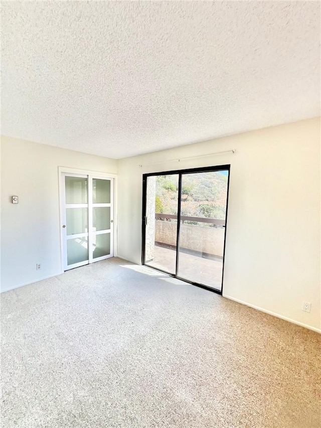 1 Cabrillo Dr, Avalon, CA 90704 - carpeted spare room with a textured ceiling