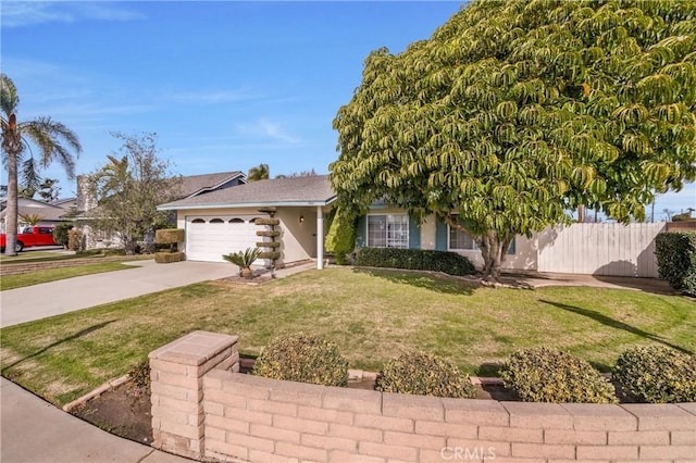 view of front of house with a garage and a front lawn