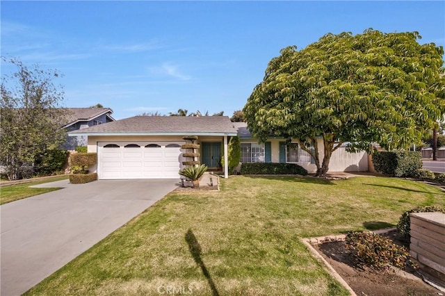 ranch-style house featuring a garage and a front lawn