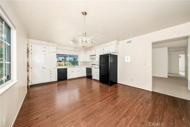 kitchen featuring black appliances, white cabinetry, a chandelier, decorative light fixtures, and dark hardwood / wood-style flooring