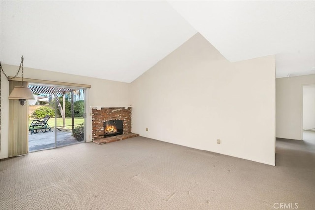 unfurnished living room with a fireplace, high vaulted ceiling, and carpet flooring