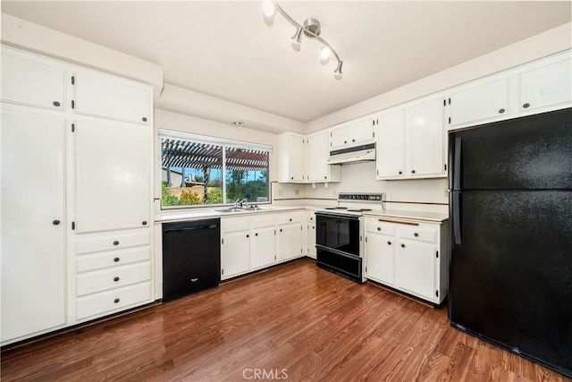 kitchen featuring dark hardwood / wood-style floors, white cabinets, black appliances, and sink