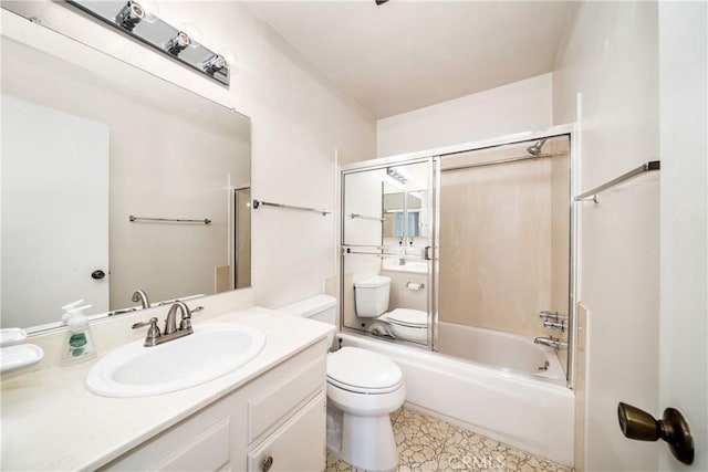 full bathroom with vanity, toilet, and combined bath / shower with glass door