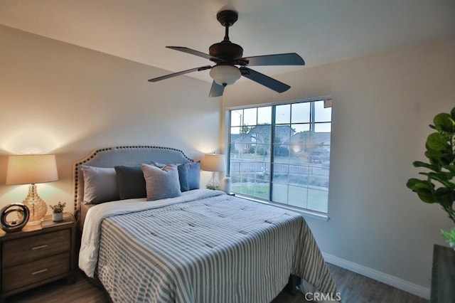 bedroom featuring dark hardwood / wood-style floors and ceiling fan