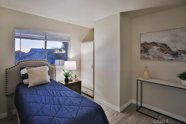 bedroom featuring hardwood / wood-style flooring