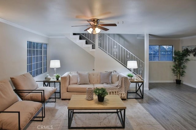 living room featuring ornamental molding, ceiling fan, and light hardwood / wood-style flooring