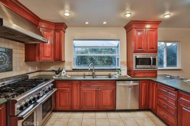 kitchen featuring sink, tasteful backsplash, ventilation hood, light tile patterned floors, and appliances with stainless steel finishes