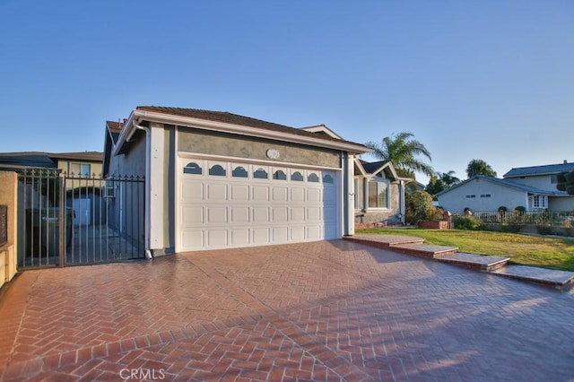 ranch-style house featuring a garage