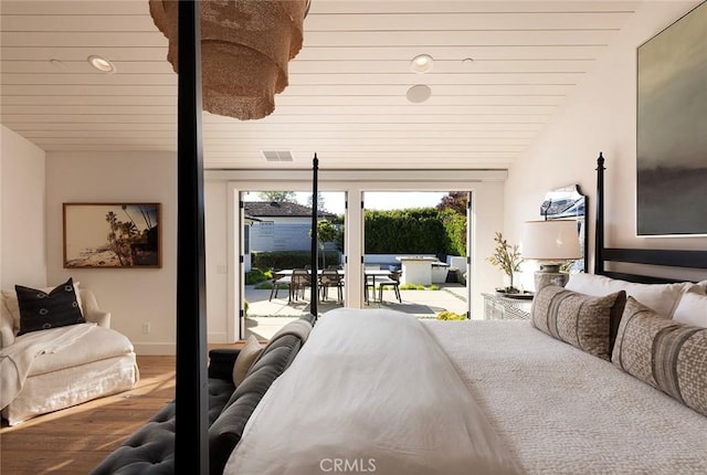 bedroom with wooden ceiling, hardwood / wood-style floors, access to outside, and vaulted ceiling