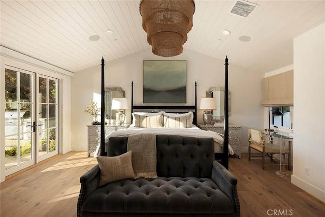 bedroom featuring wood-type flooring, vaulted ceiling, multiple windows, and wooden ceiling