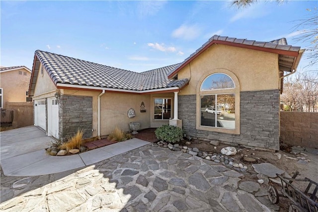 rear view of property with a garage