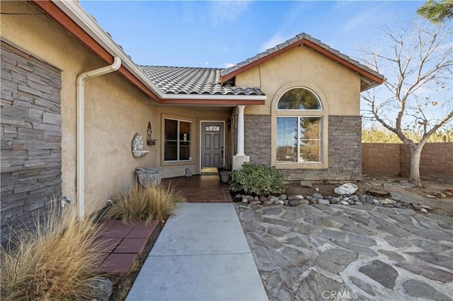 doorway to property with a patio