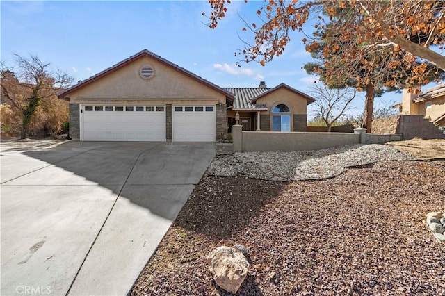 ranch-style home featuring a garage