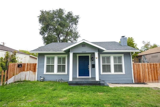 bungalow-style home featuring a front yard