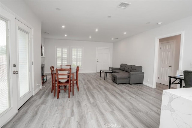 dining space featuring light hardwood / wood-style flooring