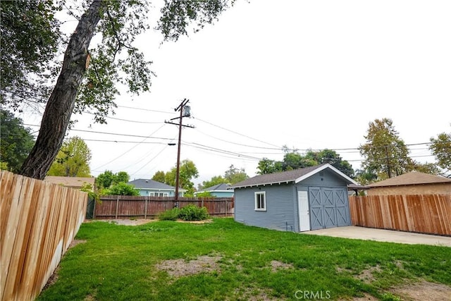 view of yard with a patio and a storage unit