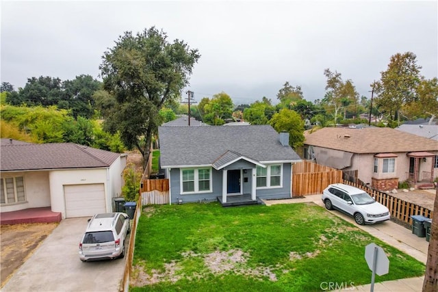 ranch-style home with a garage and a front yard