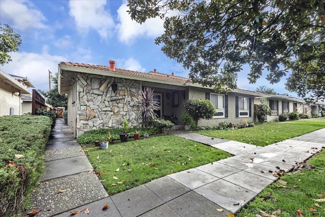 view of front of home with a front yard