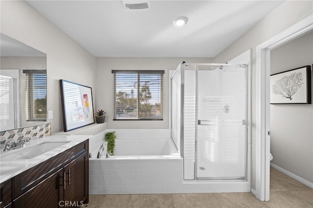 full bathroom featuring toilet, vanity, tile patterned flooring, and plus walk in shower