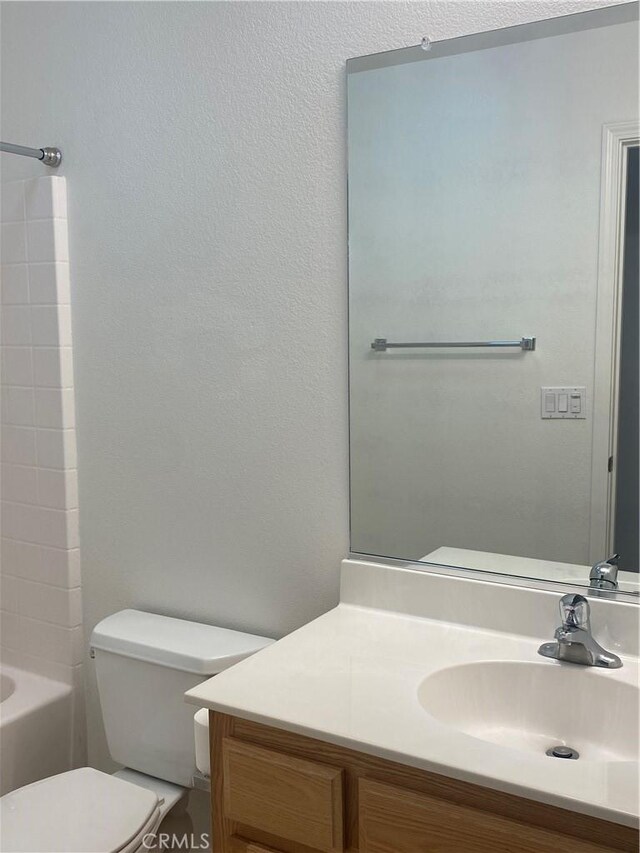 full bathroom featuring toilet, vanity, and shower / tub combination