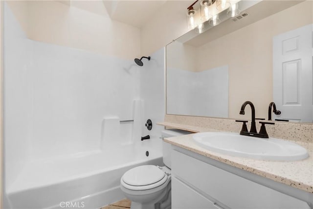 full bathroom featuring toilet, vanity, and  shower combination